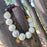 HOWLITE AND TIGER EYE (WITH GOLD LION)